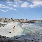 Poris 1 Beachfront By Holidays Коральео